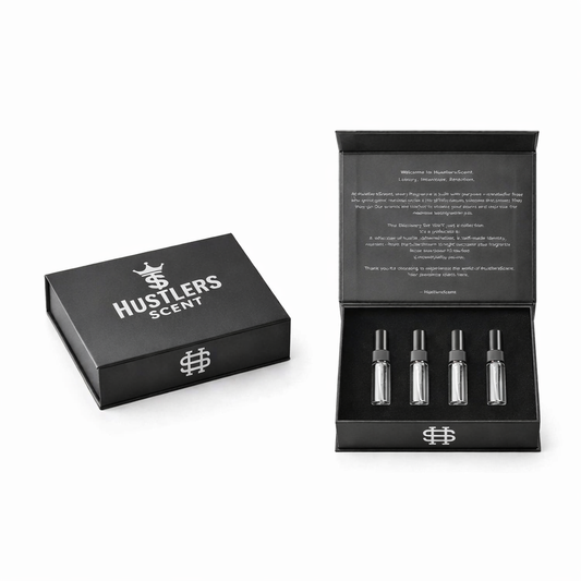 Black discovery set box, open, holding four travel sprays